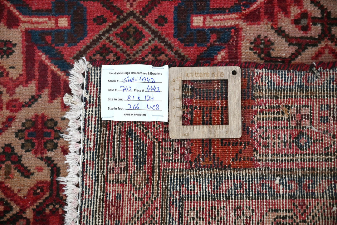 red Accent rug 2' 8" x 4' 1"