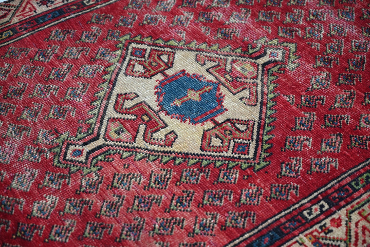 red Accent rug 2' 10" x 4' 9"