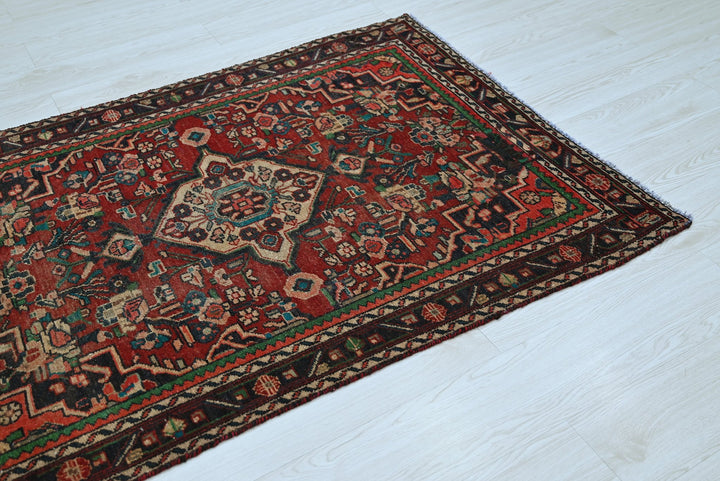 red Accent rug 3' 4" x 4' 7"