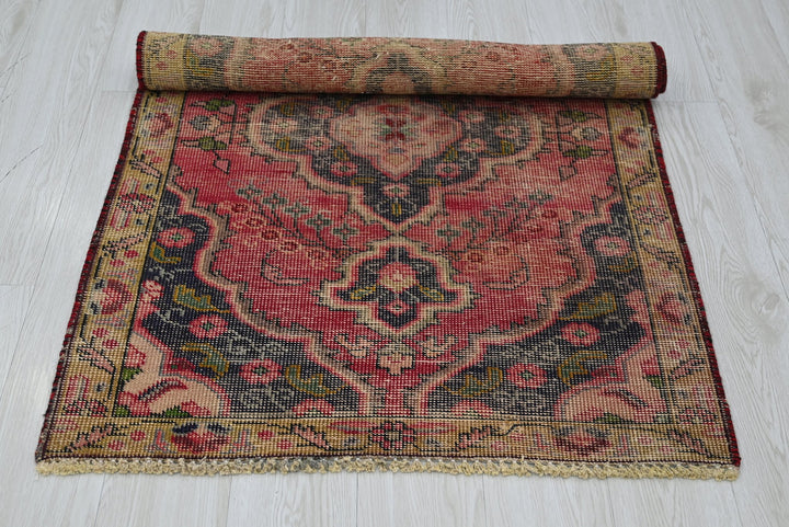 red Accent rug 2' 10" x 4' 4"