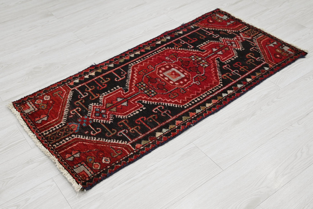 red Accent rug 1' 9" x 3' 9"