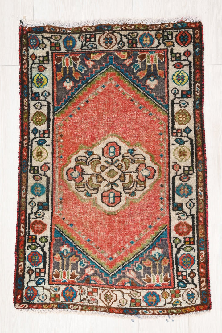 red Accent rug 1' 10" x 2' 10"