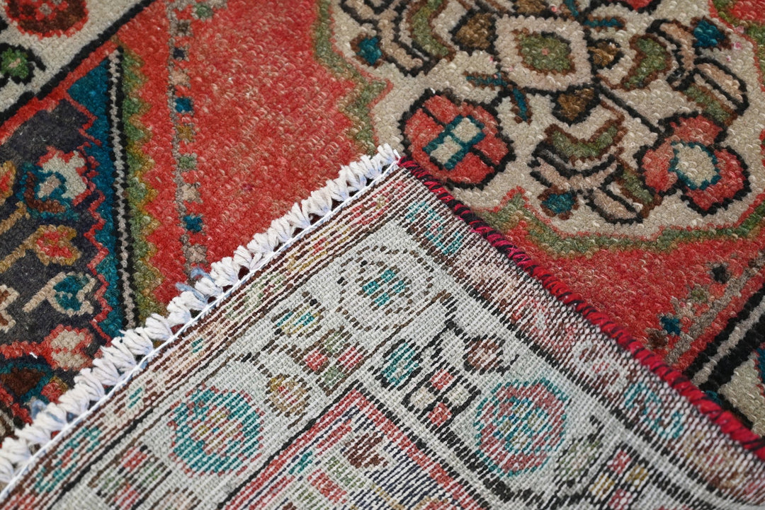 red Accent rug 1' 10" x 2' 10"