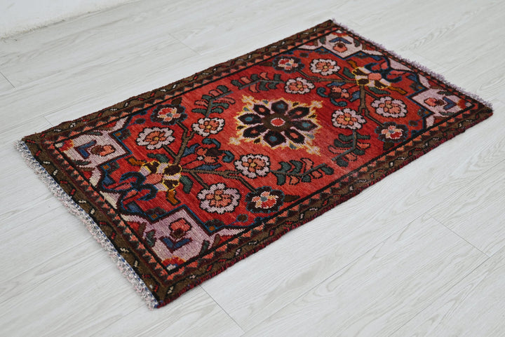 red Accent rug 1' 10" x 3' 1"