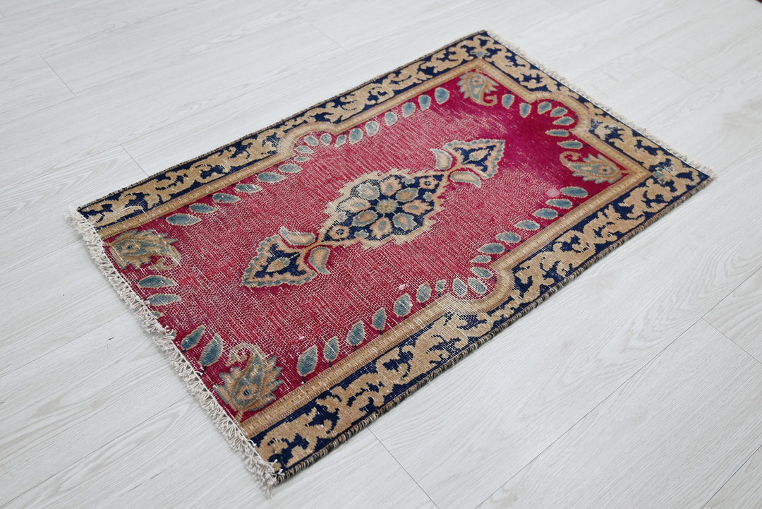 red Accent rug 1' 8" x 2' 8"