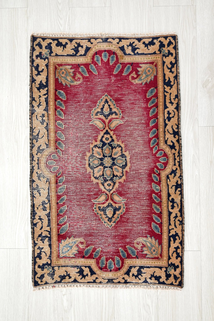 red Accent rug 1' 9" x 3' 0"