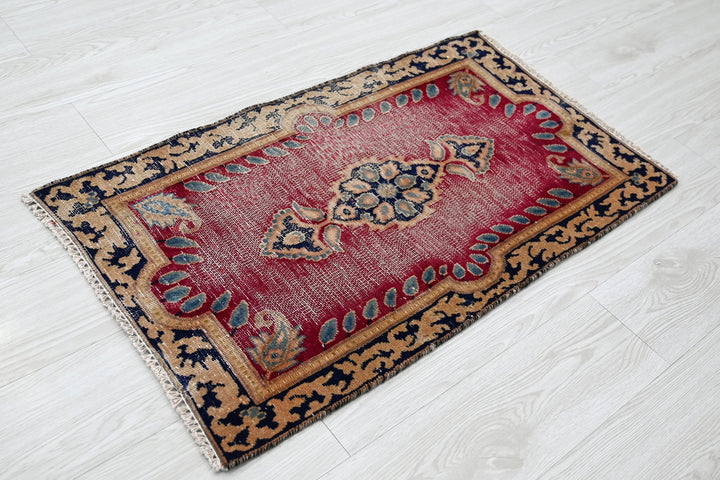 red Accent rug 1' 9" x 3' 0"