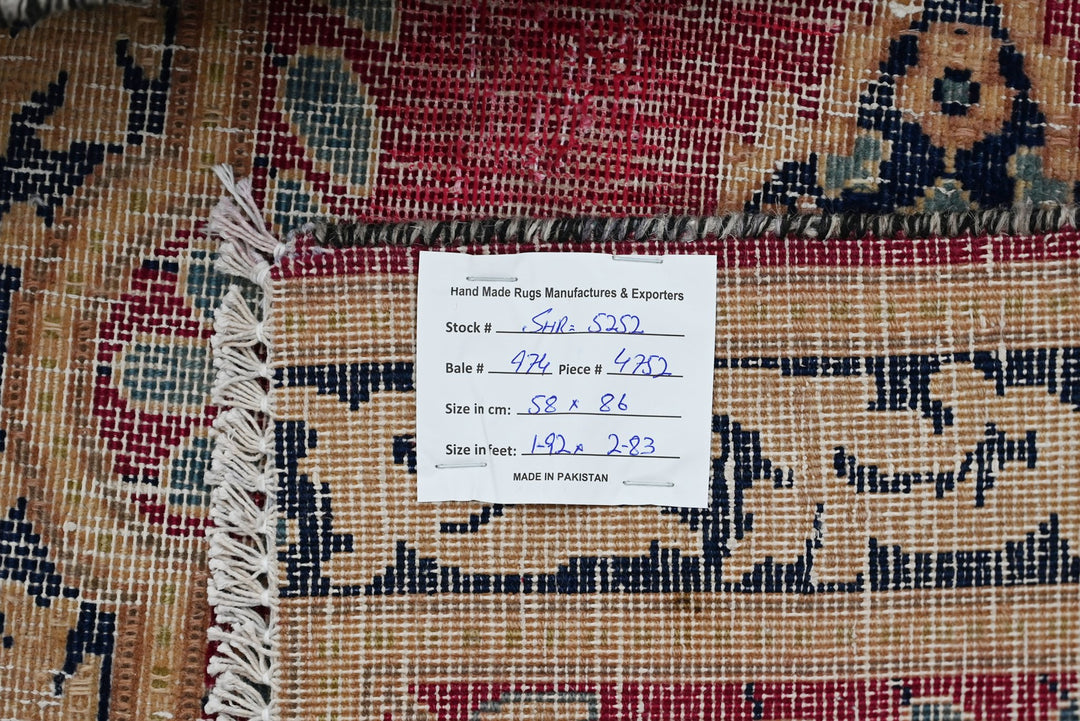 red Accent rug 1' 11" x 2' 10"