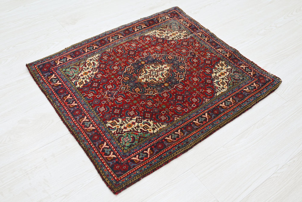 red Accent rug 2' 0" x 2' 5"