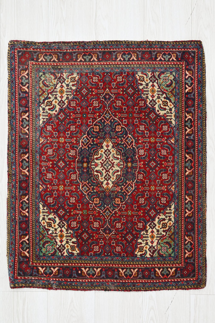 red Accent rug 2' 0" x 2' 6"