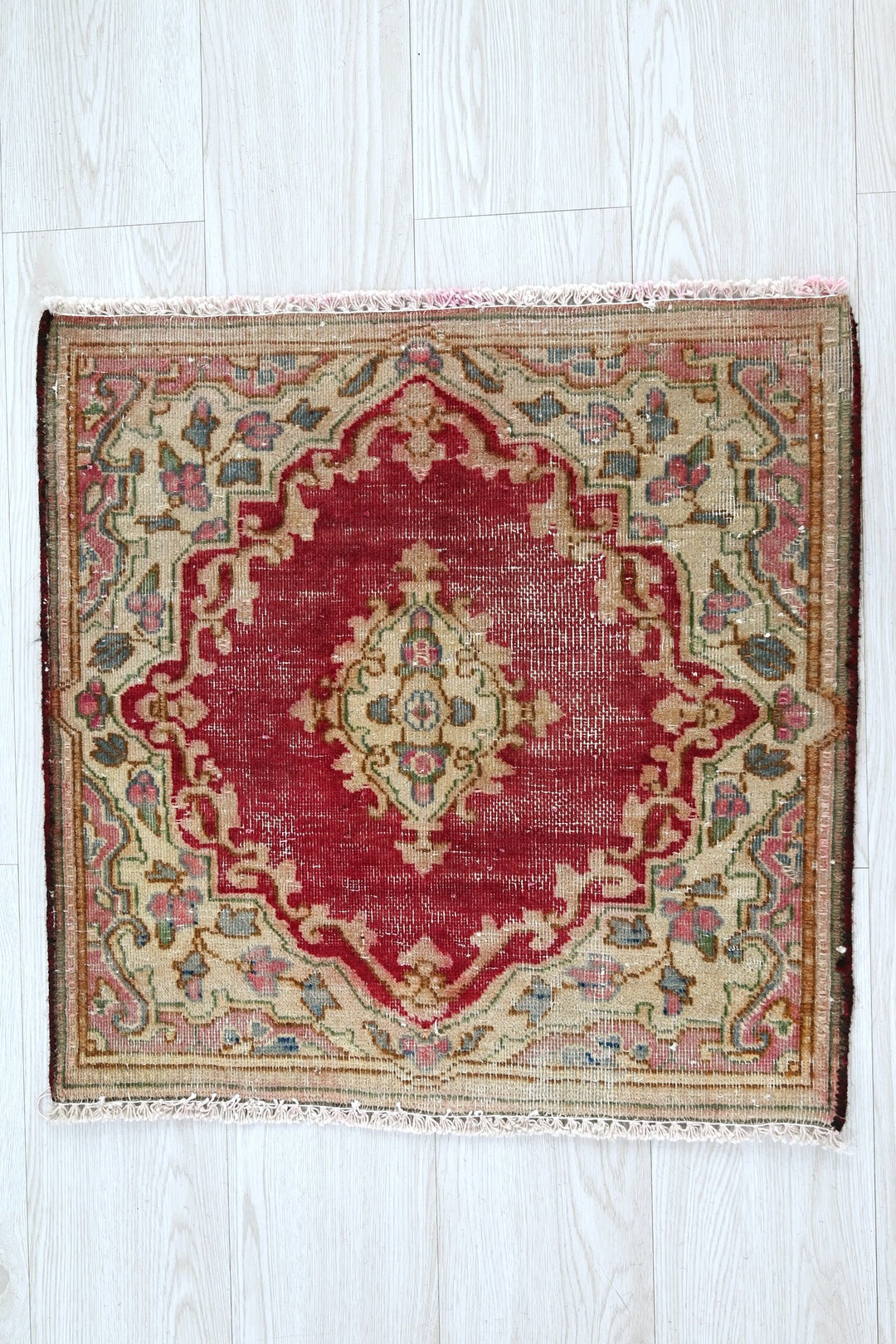 red Accent rug 1' 10" x 1' 10"