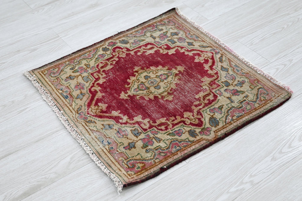 red Accent rug 1' 10" x 1' 10"