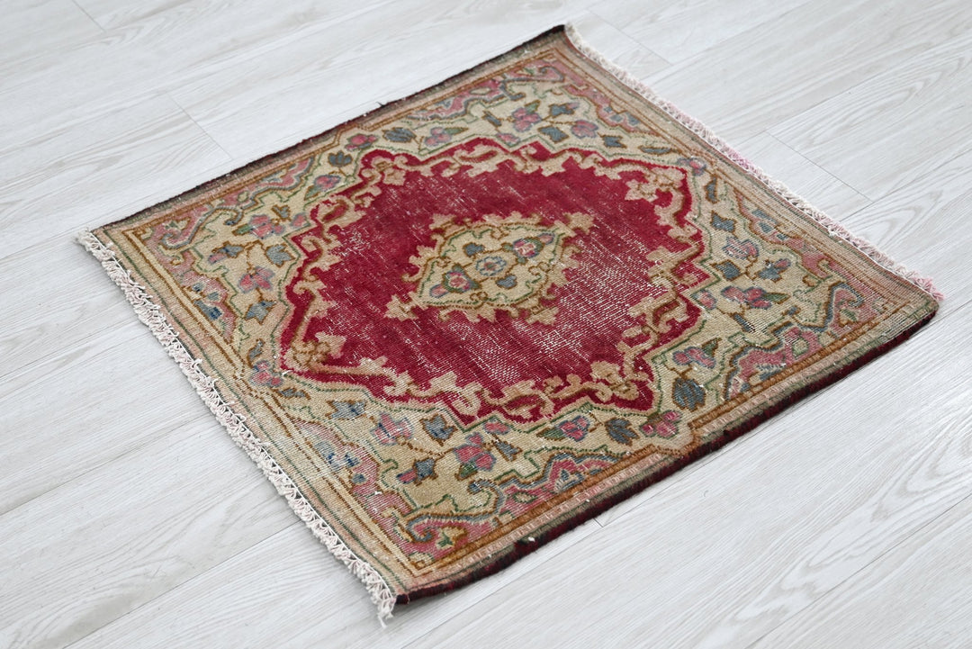 red Accent rug 1' 10" x 1' 10"