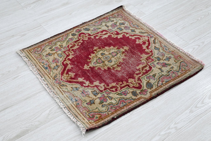 red Accent rug 1' 10" x 1' 10"