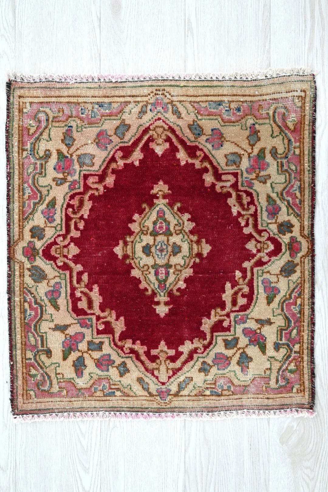 red Accent rug 1' 10" x 1' 10"