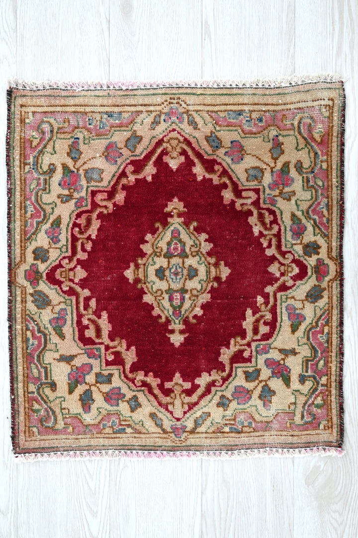 red Accent rug 1' 10" x 1' 10"