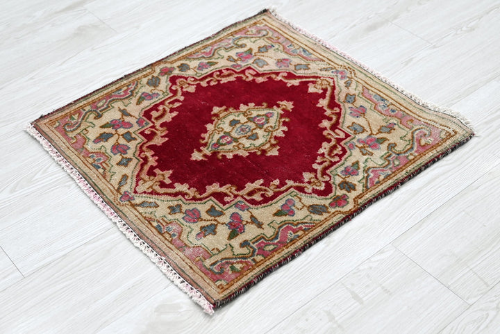 red Accent rug 1' 10" x 1' 10"