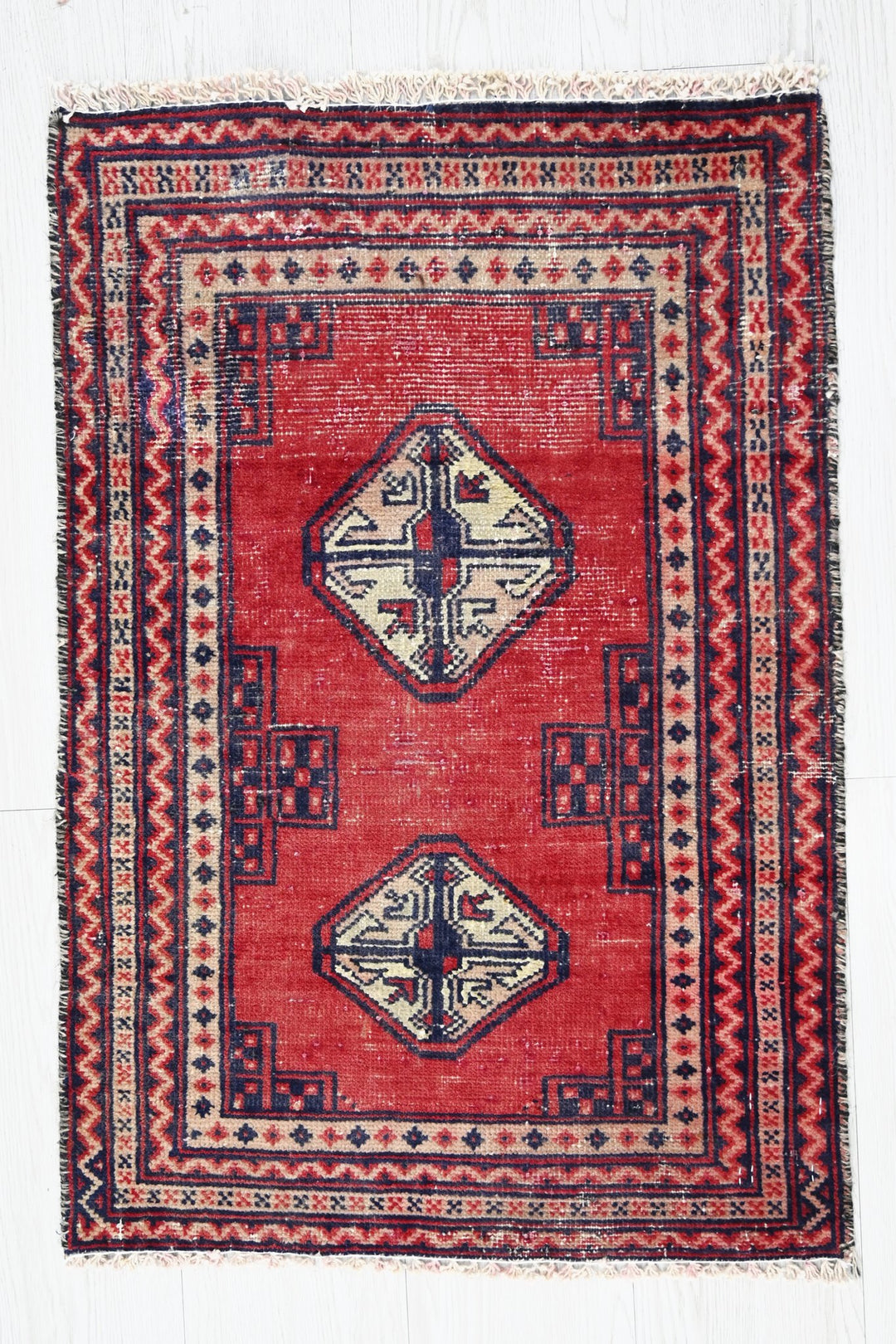 red Accent rug 1' 8" x 2' 5"