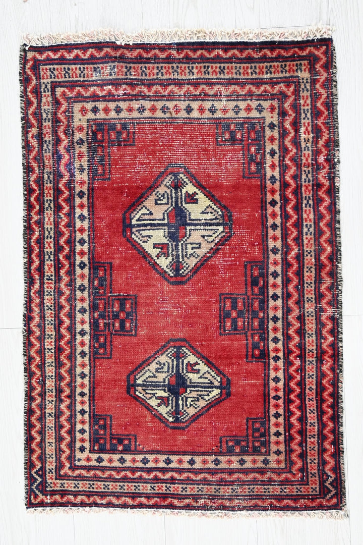 red Accent rug 1' 8" x 2' 5"