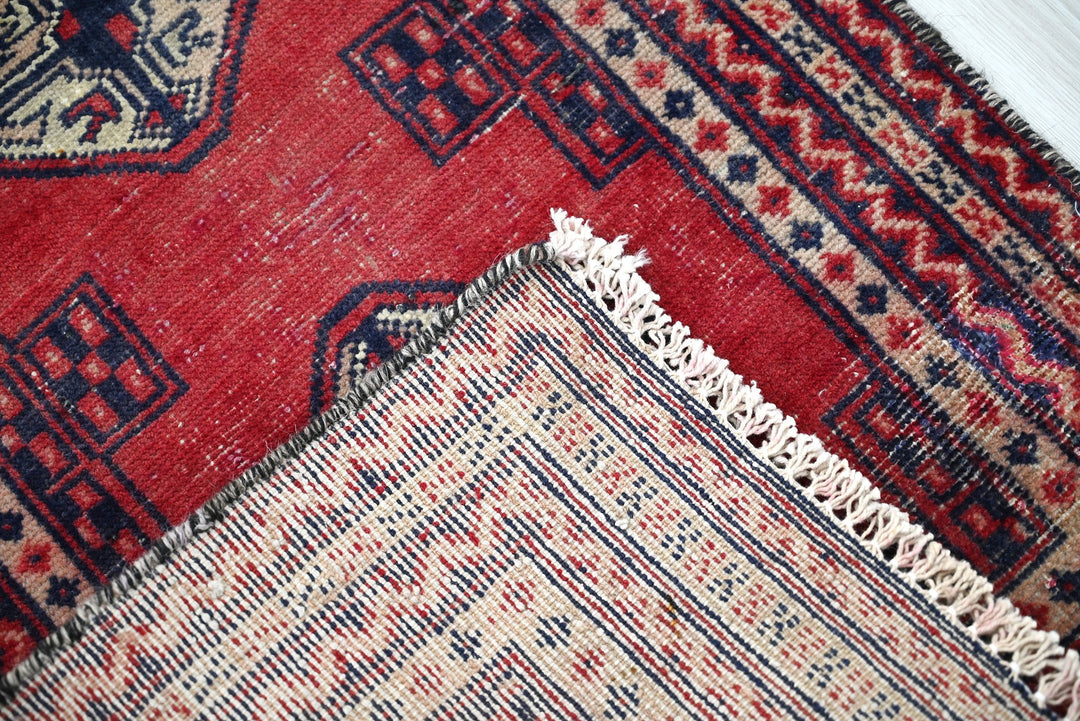 red Accent rug 1' 8" x 2' 5"