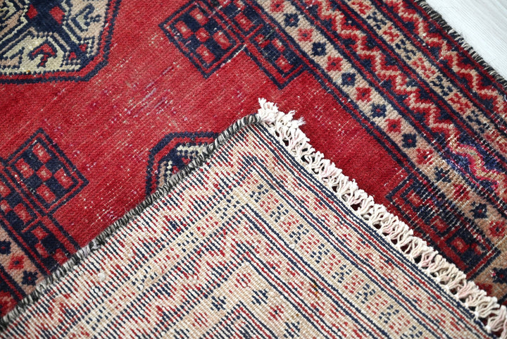 red Accent rug 1' 8" x 2' 5"