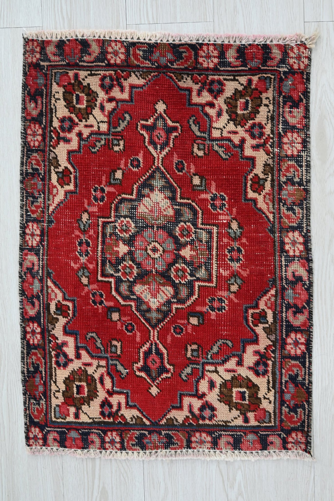 red Accent rug 1' 8" x 2' 4"