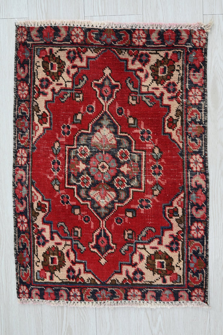 red Accent rug 1' 8" x 2' 4"