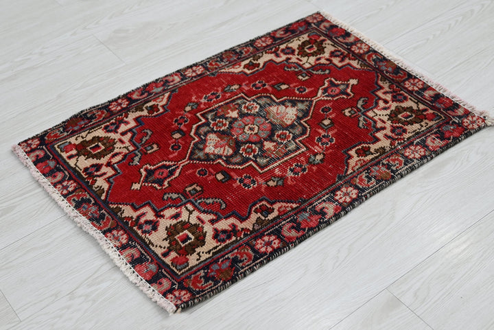 red Accent rug 1' 8" x 2' 4"