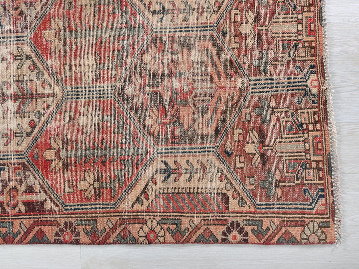 an old rug is laying on the floor