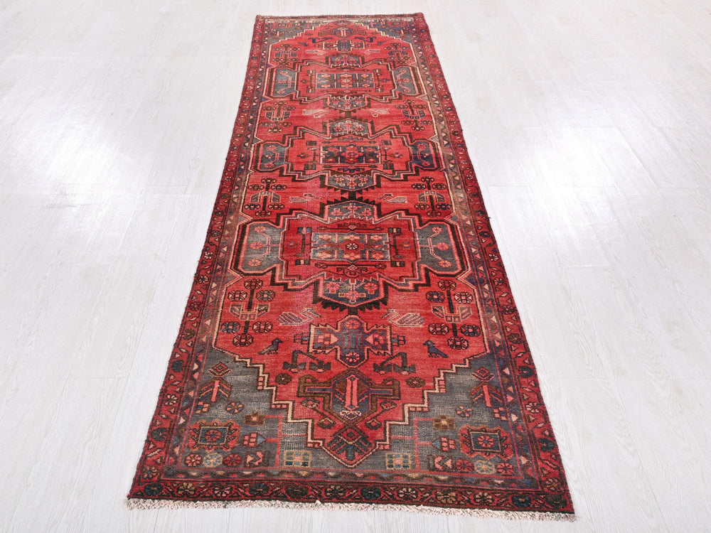 a red rug on a white floor in a room