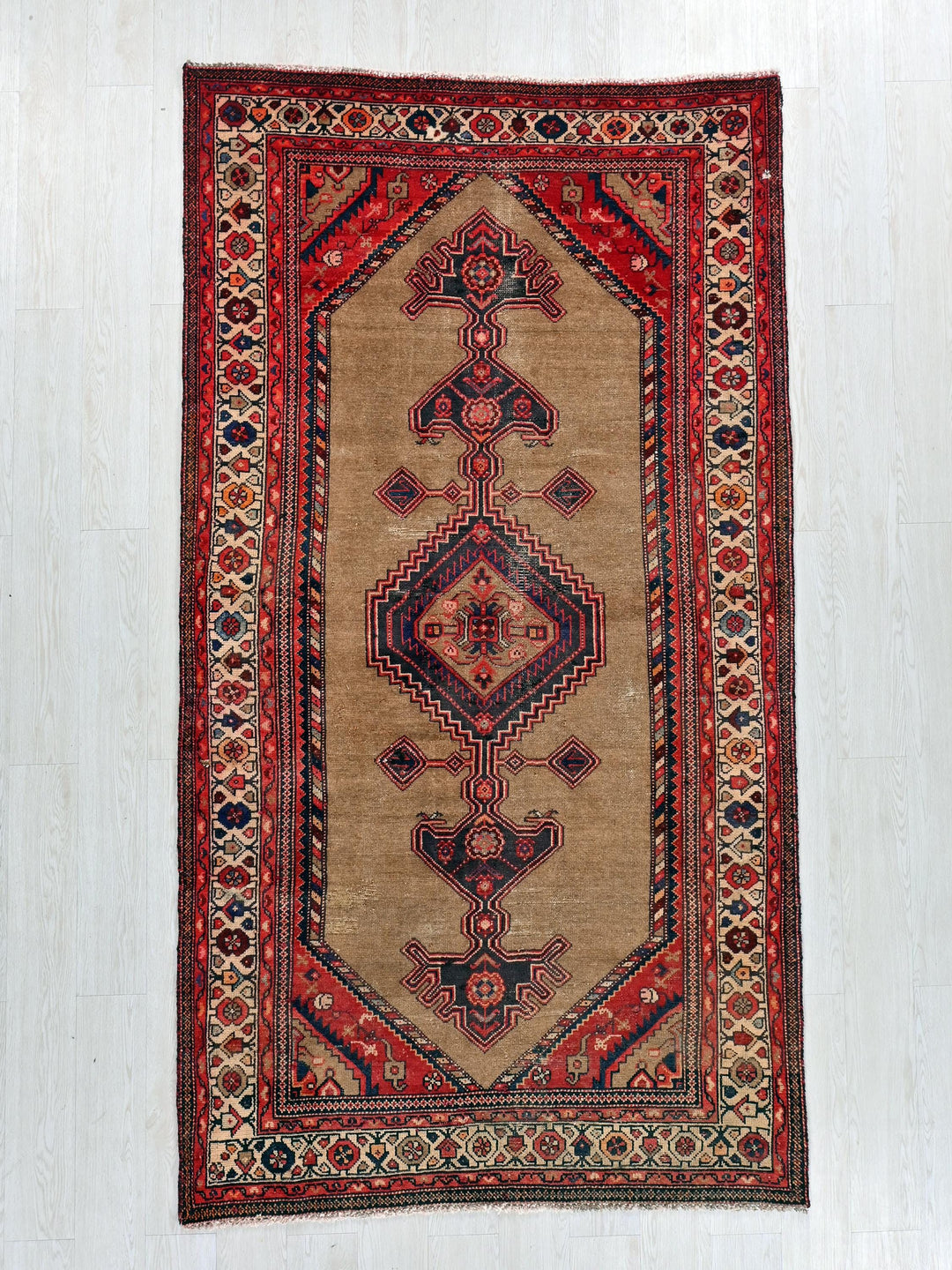 a rug hanging up on a wall