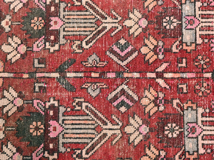 a close up of a red oriental rug