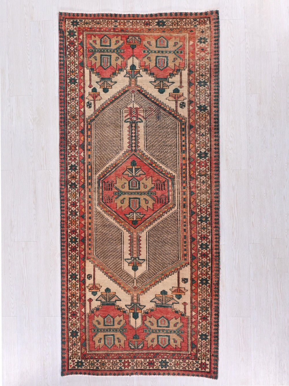 a rug hanging on a wall in a room
