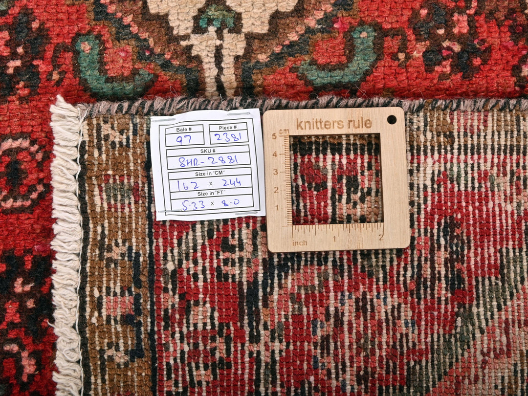 a piece of wood sitting on top of a rug