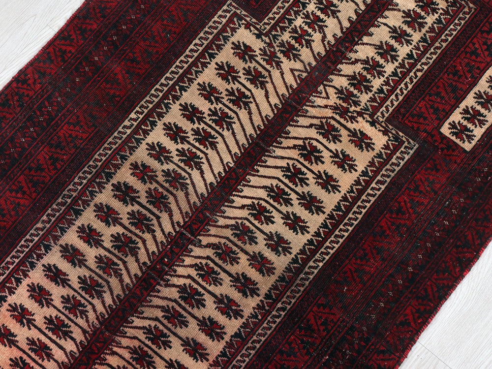 a close up of a rug on a wooden floor