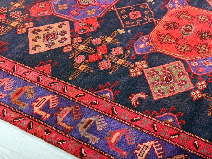 a colorful oriental rug with a blue background