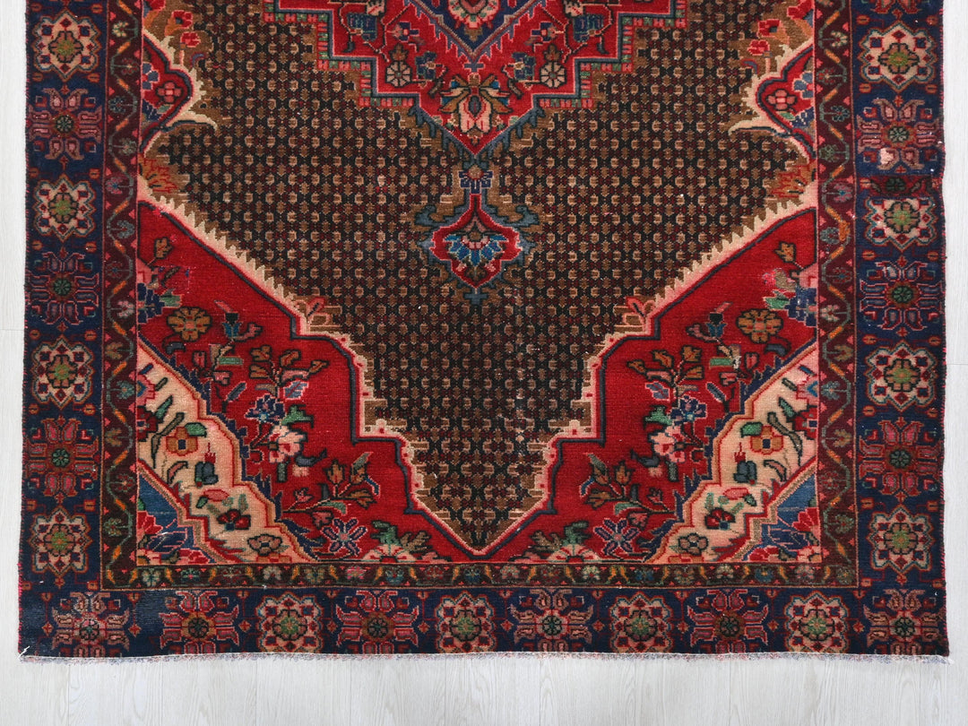 a red and blue rug on a white background