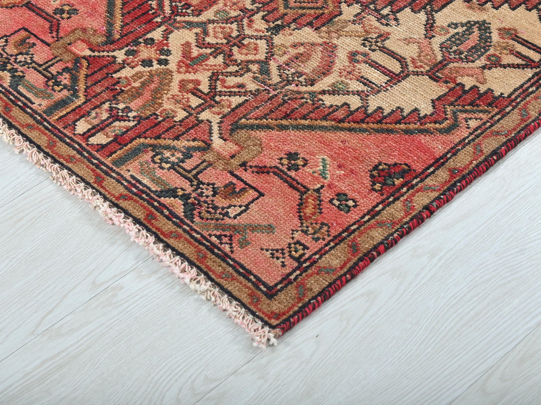 a close up of a rug on a wooden floor