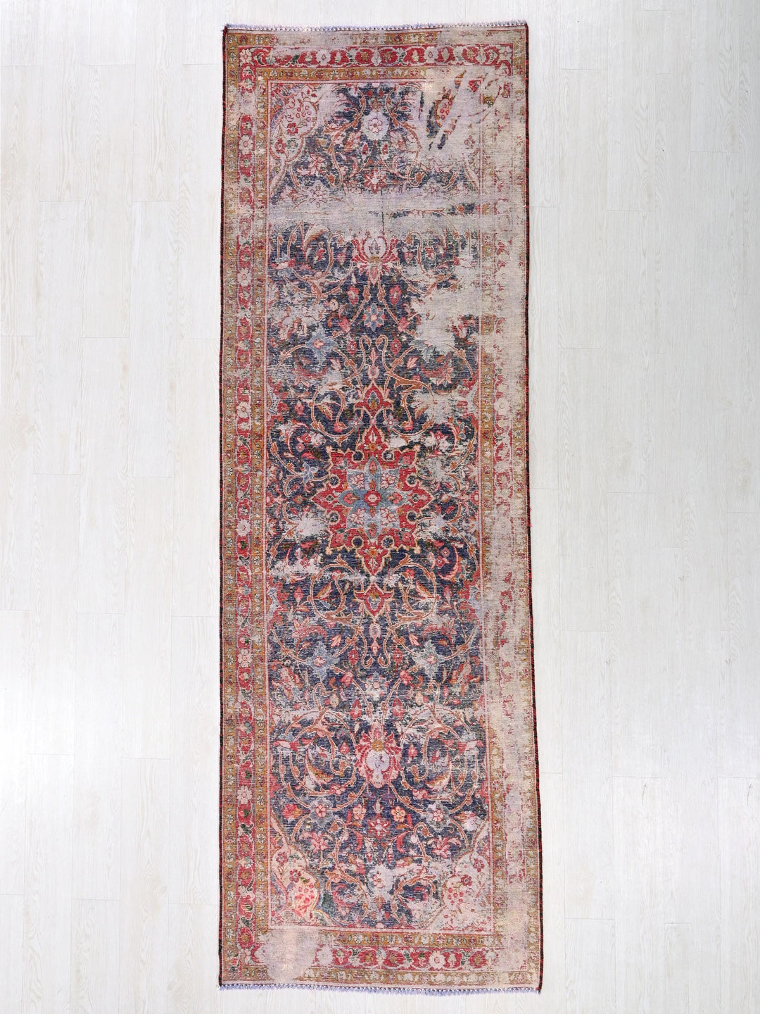 a rug hanging on a wall in a room