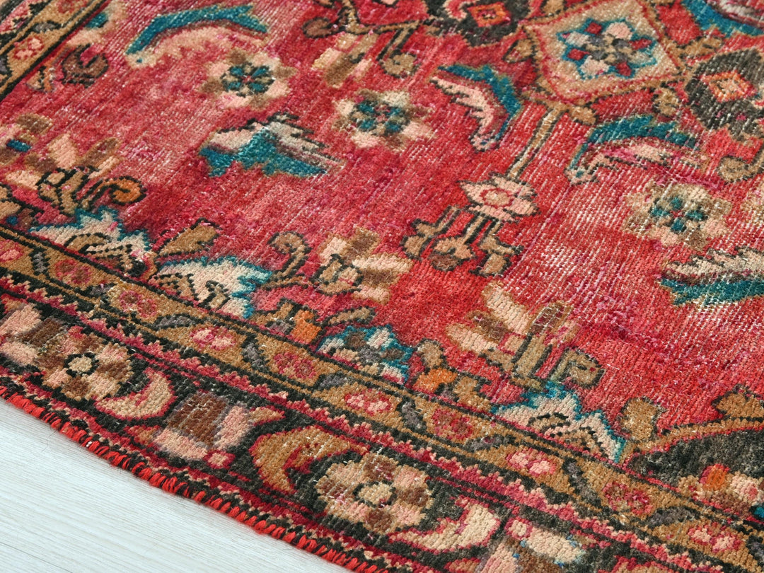 a close up of a rug on a wooden floor