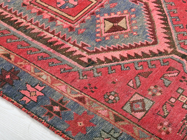 a close up of a rug on a wooden floor