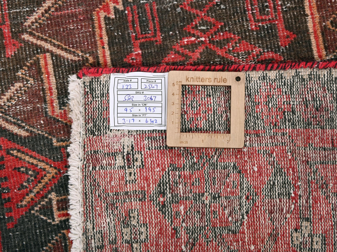 a pile of rugs with a price tag on them