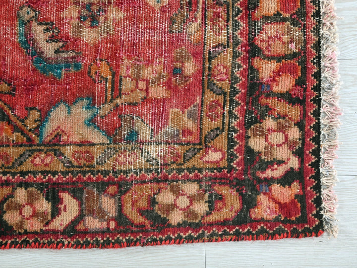 a red rug with a picture of a woman on it
