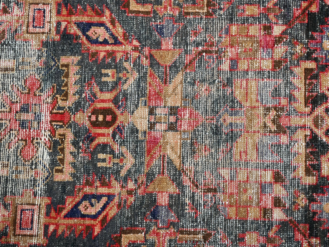 an old rug with many different colors and patterns