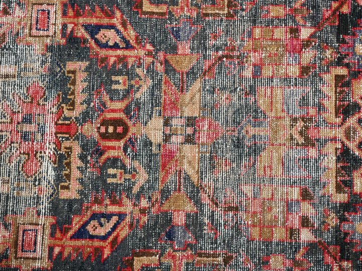 an old rug with many different colors and patterns