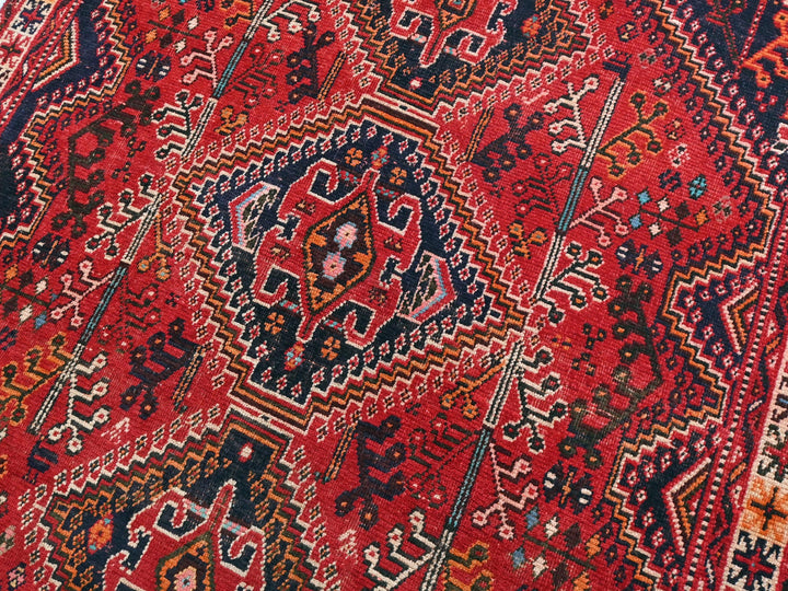 a close up of an oriental rug with many colors