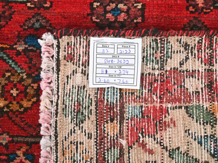 a pile of rugs with a price label on them