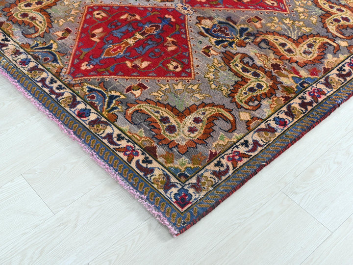 a multicolored oriental rug on a white floor