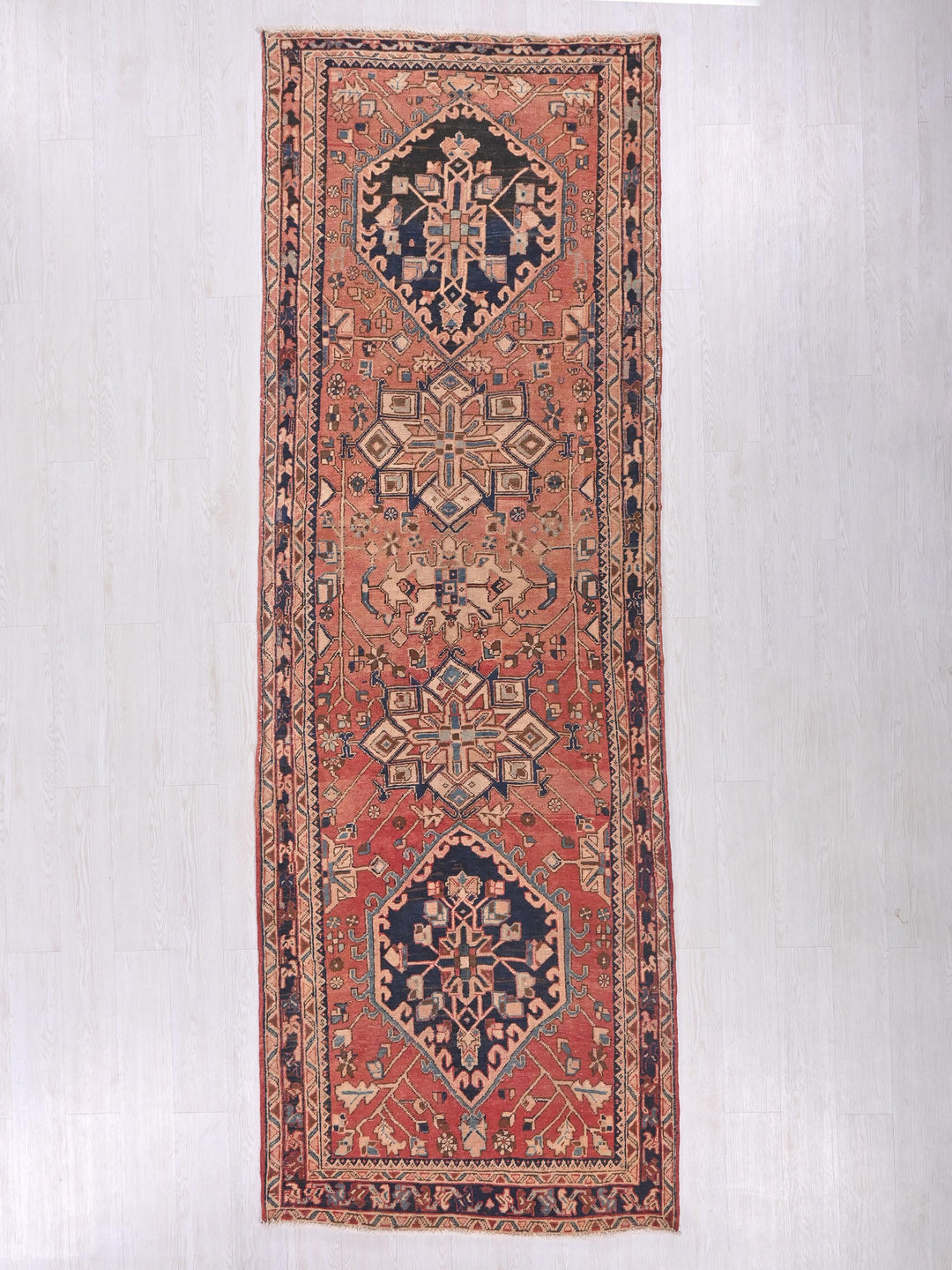 a rug hanging on a wall in a room