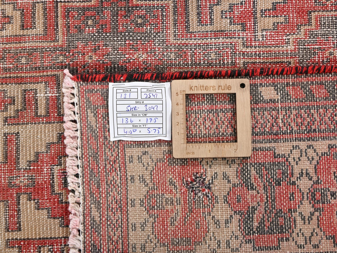 a picture frame on a rug with a name tag on it